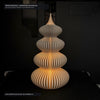 Foto reale di laboratorio DEKO a Galatone: Albero Curves Trees stampato in 3D in PLA su piatto PEI riscaldato con luce tealight LED accesa.